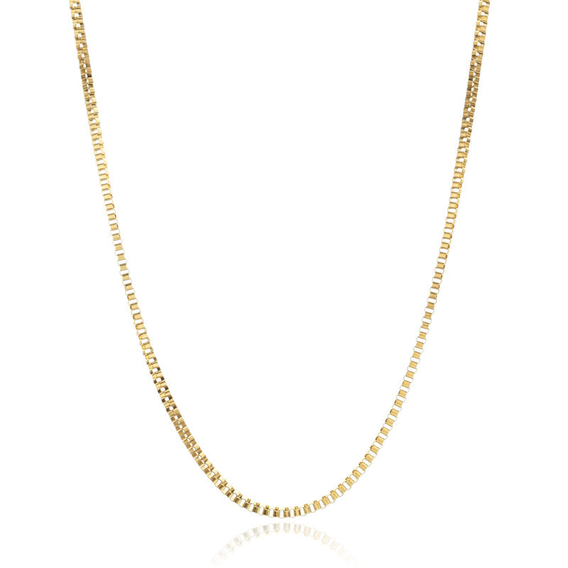Gold chain necklace on a white background