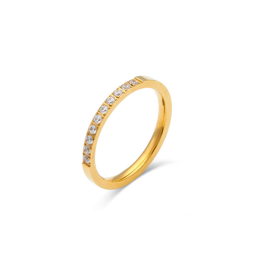 Gold ring with small diamonds on a white background